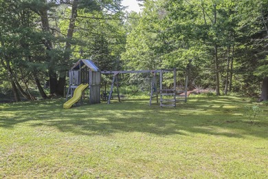 Nestled in the woods on beautifully landscaped grounds, this - photo 39