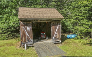 Nestled in the woods on beautifully landscaped grounds, this - photo 40