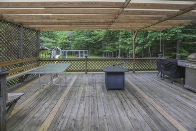Nestled in the woods on beautifully landscaped grounds, this - photo 43