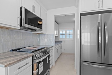 Experience an exceptional standard of Gulf-front living in this - photo 13