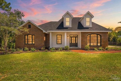 Tucked away on nearly two acres on Soundside Drive, this - photo 1