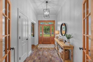 Tucked away on nearly two acres on Soundside Drive, this - photo 3