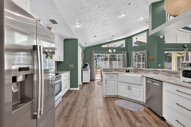 Palm trees sway over your private, screened pool at this move-in - photo 16
