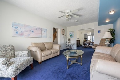 Deceptive from the outside, this expanded Colonial home offers - photo 3