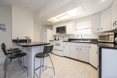 Deceptive from the outside, this expanded Colonial home offers - photo 4
