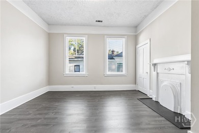 This well-maintained four-unit property offers investors a rare - photo 11