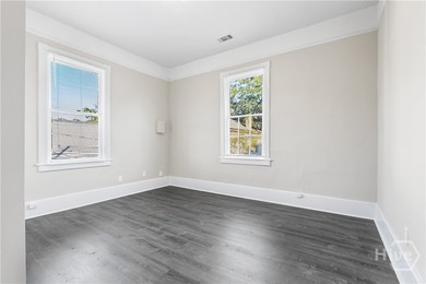 This well-maintained four-unit property offers investors a rare - photo 15