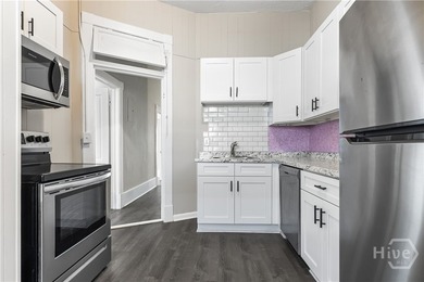 This well-maintained four-unit property offers investors a rare - photo 21