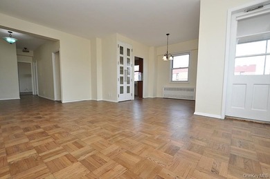 Perched on the top-floor corner, this sun-drenched 2-bedroom - photo 9