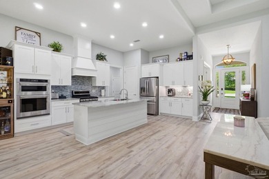 Welcome to this stunning custom-built home located in the gated - photo 3