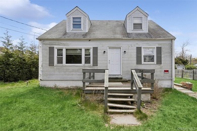 Welcome to 56 Inlet Rd W, a charming two-story cape home nestled - photo 1
