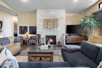 Discover this masterfully upgraded, lightly lived-in gem where