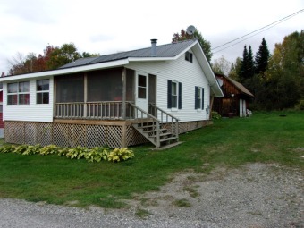Don't miss this one! This 2 bedroom, 2 bath cottage has all the - Lake Home For Sale in Westmore, Vermont