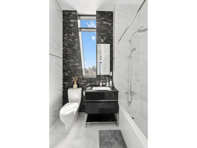 Residence 6E at 88 Withers Street is a stunning , design-forward - photo 8