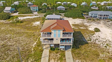 This coastal masterpiece offers unparalleled beachfront living
