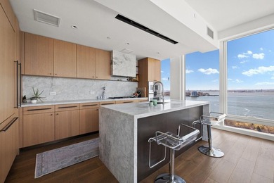 Residence 16B at Quay Tower offers exceptional waterfront living - photo 3