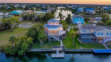 ICONIC PINK three-story octagon WATERFRONT home with PRESERVE & - photo 1