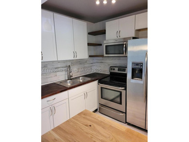Unit Rented, completely updated featuring a new kitchen, new - photo 3