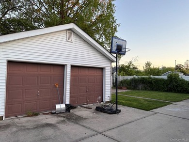 The home features a large driveway, a two-car garage, stainless - photo 13