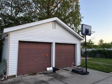 The home features a large driveway, a two-car garage, stainless - photo 14