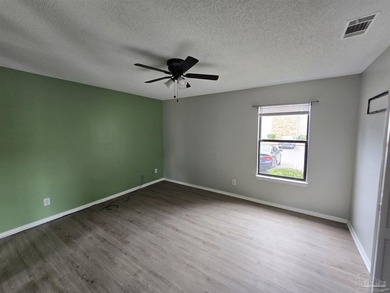 This 1st-floor condo in Sunrunner Condominiums features 2 - photo 8