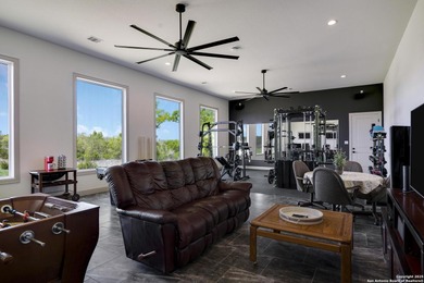 Discover this exceptional Hill Country luxury home situated on 5