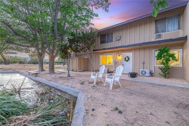 Wake up to tranquil waterfront views in this beautifully updated - photo 1