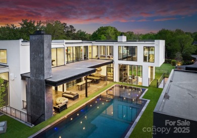 Situated on over 1.75 acres in SouthPark's sought after Carmel