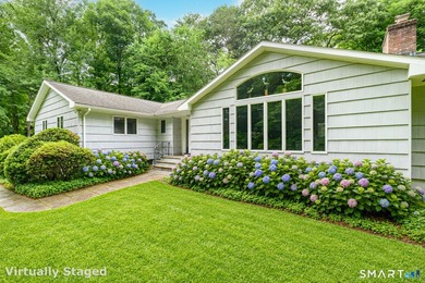 Introducing an exceptional ranch-style retreat nestled on a - photo 1