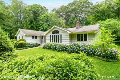 Introducing an exceptional ranch-style retreat nestled on a - photo 2