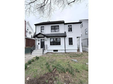 Welcome to this beautifully renovated one-family home with an - photo 1