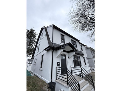 Welcome to this beautifully renovated one-family home with an - photo 2