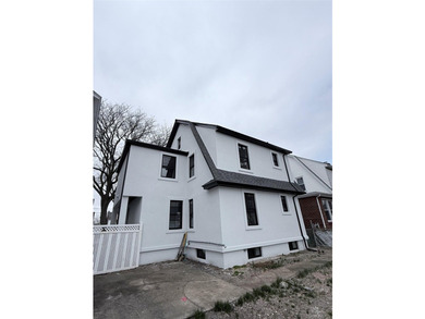 Welcome to this beautifully renovated one-family home with an - photo 3
