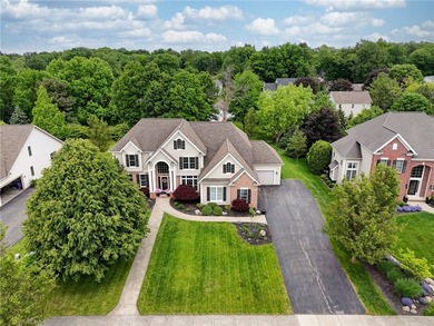 Stunning custom built Colonial nestled in one of Penfield's most - photo 2