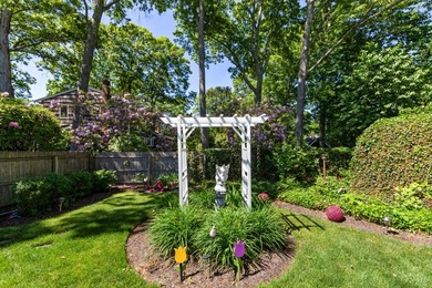 Set on a quiet lane in Bellport Village, this three-bedroom - photo 11
