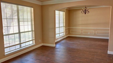 Welcome to this spacious 6-bedroom, 3.5-bath home in one of The - photo 7