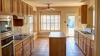 Welcome to this spacious 6-bedroom, 3.5-bath home in one of The - photo 9