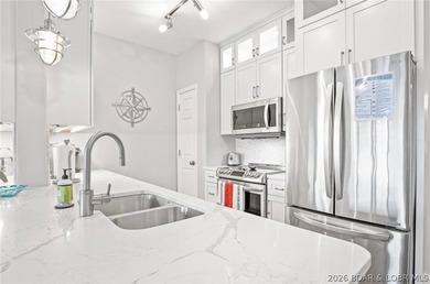 THIS ONE HAS IT ALL! Perched at the penthouse level, this - photo 5