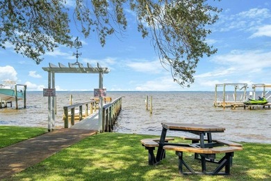 Discover Pelican Bay's Bayfront community, a serene, gated - photo 16