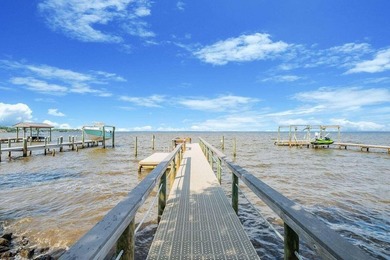 Discover Pelican Bay's Bayfront community, a serene, gated - photo 19