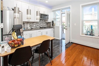 Recently renovated One family attached, all brick home in a - photo 5