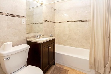 Recently renovated One family attached, all brick home in a - photo 9