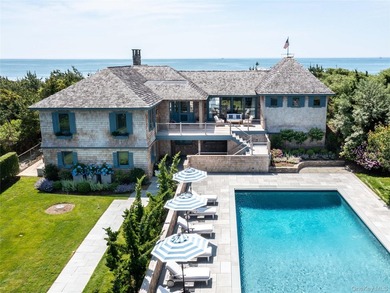 Set along the coveted shores of Dune Road in Quogue, this - photo 2