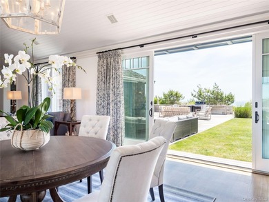 Set along the coveted shores of Dune Road in Quogue, this - photo 8
