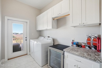 This beautifully maintained elevated waterfront home located in