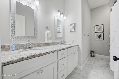 This beautifully maintained elevated waterfront home located in