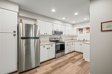 Welcome home to this spacious second-floor condominium tucked - photo 9