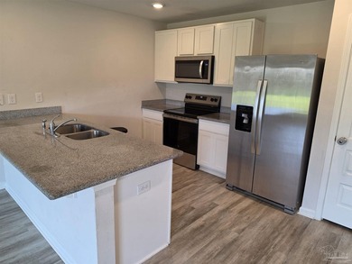 The Freeport is a cozy 4 bed, 2 bath open floorplan home located - photo 3