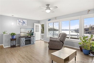 Discover the ultimate lakefront retreat with this stunningly - photo 1