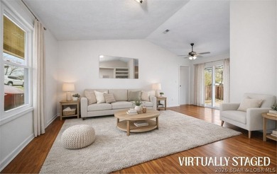 Escape to this charming and affordable lake retreat, just - photo 1